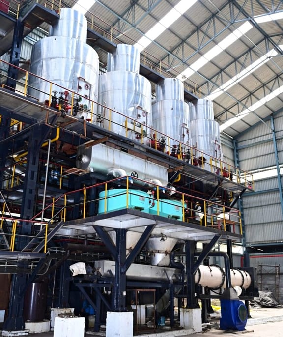Inside a cane sugar refinery: stainless processing vessels, pipework and access platforms