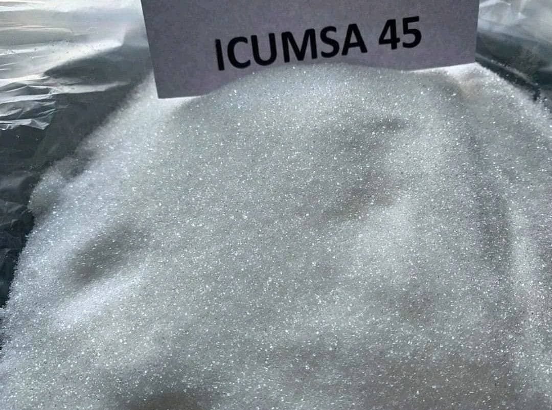 White granulated ICUMSA 45 sugar in an opened bag, labelled with an ICUMSA 45 card